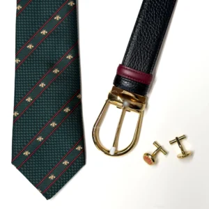 Men's accessories gift set with green tie, black belt with gold buckle and gold cufflink