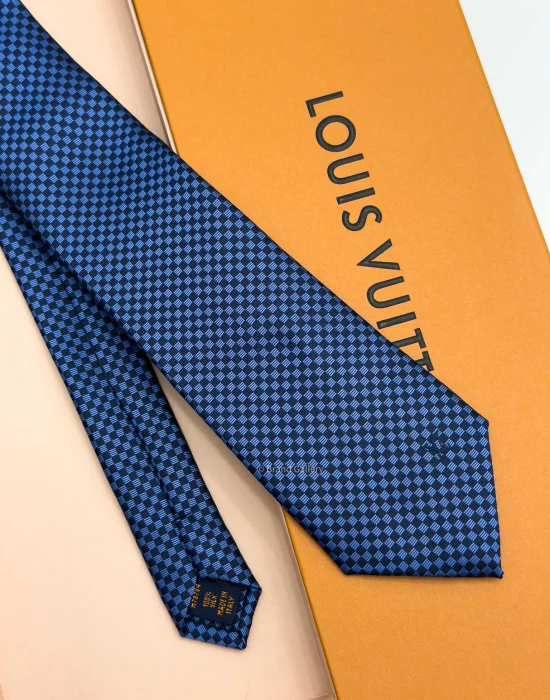 Blue Micro Damier silk tie with navy and bright blue geometric check pattern