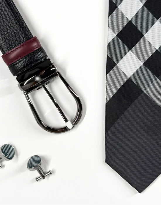 Men's accessories gift set with grey tie, black belt with gunk-metal buckle and silver cufflink